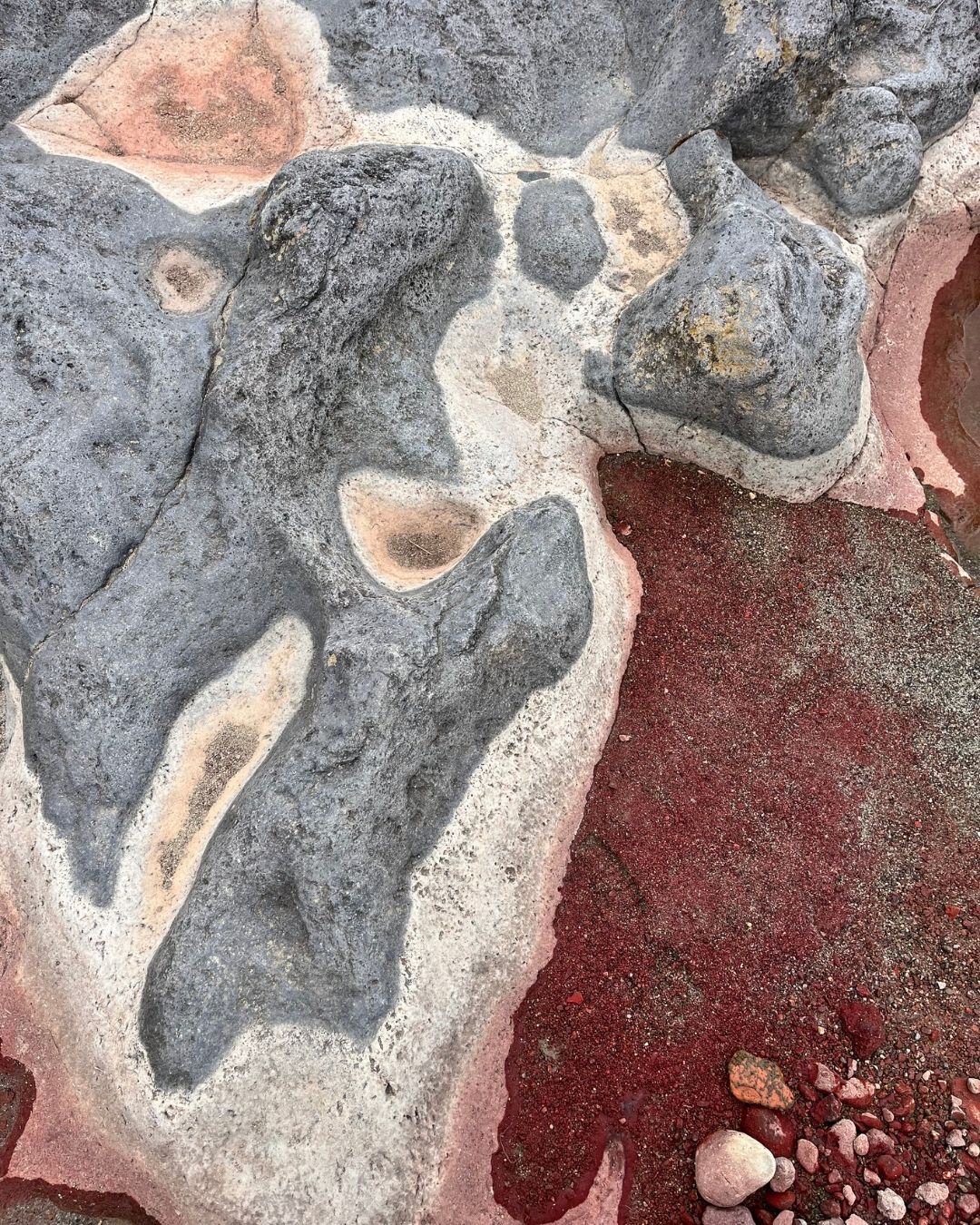 Volcanic rock and red sand